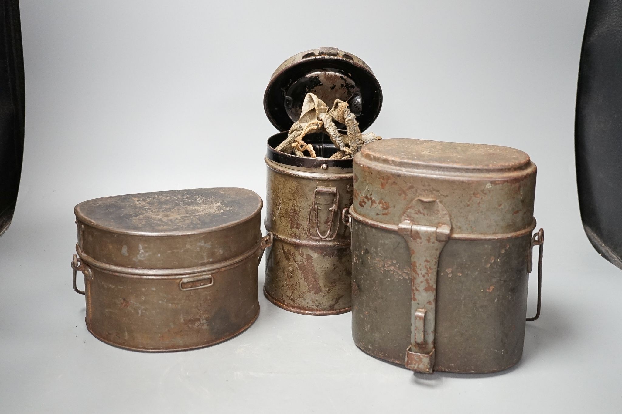 WWI German gas mask, two German trench mess tins and a German leather belt case